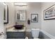 Charming powder room featuring a vessel sink, granite countertop, and decorative mirror at 1274 Ridge Vista Ct, Lawrenceville, GA 30043