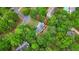 Aerial view showcases the home nestled among lush trees and landscaping at 2005 Sweetgum Trl, Cumming, GA 30041