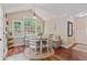 Cozy breakfast nook features a built-in bench, a table, and views of the backyard at 2005 Sweetgum Trl, Cumming, GA 30041