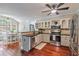 Charming kitchen boasts stainless steel appliances, granite countertops, and an adjacent breakfast nook at 2005 Sweetgum Trl, Cumming, GA 30041