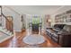Spacious living room with hardwood floors, bar area, and bright, natural light at 2005 Sweetgum Trl, Cumming, GA 30041
