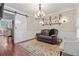 Cozy living room with barn door, stylish lighting, and modern decor at 2005 Sweetgum Trl, Cumming, GA 30041
