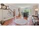Inviting living room with hardwood floors, bar area, and bright, natural light at 2005 Sweetgum Trl, Cumming, GA 30041