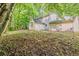 Back exterior view of a home showcasing the large yard at 5786 Longbow Dr, Stone Mountain, GA 30087
