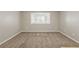 Neutral carpeted basement room with a bright window at 5786 Longbow Dr, Stone Mountain, GA 30087