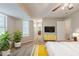 Staged bedroom showcasing carpet, natural light, and hallway access at 5786 Longbow Dr, Stone Mountain, GA 30087