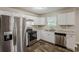 Kitchen featuring stainless steel appliances, gas range, and laminate countertops at 5786 Longbow Dr, Stone Mountain, GA 30087