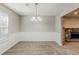 Cozy living room area with a fireplace and lots of light at 5786 Longbow Dr, Stone Mountain, GA 30087