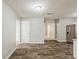 Open floor plan with hardwood style floors and easy access to the kitchen at 5786 Longbow Dr, Stone Mountain, GA 30087