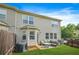 Private backyard with green lawn, patio area and privacy fence at 5830 Keystone Pt, Lithonia, GA 30058