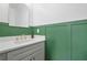 Updated bathroom with marble counters, gold fixtures, and painted wall trim at 5830 Keystone Pt, Lithonia, GA 30058