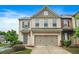 Charming two-story townhome with a brick facade and a convenient attached two-car garage at 5830 Keystone Pt, Lithonia, GA 30058