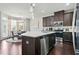 Kitchen with large island, stainless steel appliances, and view of adjacent dining area at 5830 Keystone Pt, Lithonia, GA 30058