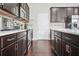 Close up shot of kitchen with stainless steel appliances, ample counter space, and dark wood cabinets at 5830 Keystone Pt, Lithonia, GA 30058