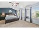 Bright and airy main bedroom with large windows and neutral decor at 5830 Keystone Pt, Lithonia, GA 30058