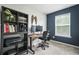 Office with storage bookcase and work station with dual monitors at 5830 Keystone Pt, Lithonia, GA 30058