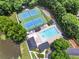 Aerial view of the community pool and tennis courts at 963 Hawk Creek Trl, Lawrenceville, GA 30043