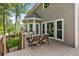 Outdoor back deck perfect for entertaining or relaxing, with views of the wooded backyard at 963 Hawk Creek Trl, Lawrenceville, GA 30043
