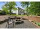 Backyard fire pit and large, multi-story home at 963 Hawk Creek Trl, Lawrenceville, GA 30043