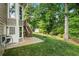 Lush green lawn in backyard, complete with storage shed, ideal for outdoor enjoyment at 963 Hawk Creek Trl, Lawrenceville, GA 30043