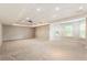 Finished basement offers recessed lighting, projector, neutral carpet, and plenty of space for entertainment at 963 Hawk Creek Trl, Lawrenceville, GA 30043