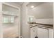 Basement bar featuring a sink and mini refrigerator with a view of the recreation area at 963 Hawk Creek Trl, Lawrenceville, GA 30043