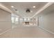 Finished basement features recessed lighting, carpet, and space for a pool table and entertaining at 963 Hawk Creek Trl, Lawrenceville, GA 30043