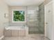 Bathroom with soaking tub, and frameless glass shower enclosure at 963 Hawk Creek Trl, Lawrenceville, GA 30043