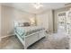 Comfortable bedroom featuring a large bed and closet at 963 Hawk Creek Trl, Lawrenceville, GA 30043