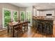 Charming dining area connects to the kitchen, complemented by large windows with a view of the outdoor scenery at 963 Hawk Creek Trl, Lawrenceville, GA 30043