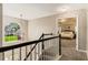 Upstairs hallway with view to bedroom and stairs at 963 Hawk Creek Trl, Lawrenceville, GA 30043