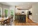 Eat-in kitchen features a stone breakfast bar, stainless appliances, and ample natural light from surrounding windows at 963 Hawk Creek Trl, Lawrenceville, GA 30043