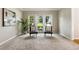 Inviting living room with carpet flooring, neutral walls, and comfortable seating near large windows at 963 Hawk Creek Trl, Lawrenceville, GA 30043
