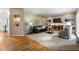 Open living area with hardwood floors, fireplace, built-in shelving, and comfortable seating arrangement at 963 Hawk Creek Trl, Lawrenceville, GA 30043