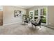 Bright and spacious living room with neutral decor, large windows, carpet, and comfortable seating at 963 Hawk Creek Trl, Lawrenceville, GA 30043