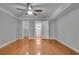 Bedroom with hardwood floors, a closet, and neutral paint at 1015 Dunbar Dr, Dunwoody, GA 30338