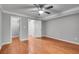 Bedroom with hardwood floors, a closet with wire shelving, and neutral paint at 1015 Dunbar Dr, Dunwoody, GA 30338