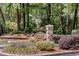Community entrance sign with decorative landscaping, 