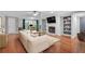 Bright and airy living room with a fireplace, built-in shelves, and large windows at 1015 Dunbar Dr, Dunwoody, GA 30338