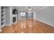 Bright living room with hardwood floors, a cozy fireplace, and a ceiling fan at 1015 Dunbar Dr, Dunwoody, GA 30338