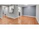 Living room with hardwood floors and an open view to the kitchen at 1015 Dunbar Dr, Dunwoody, GA 30338