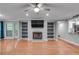 Open concept living room featuring hardwood floors, fireplace and view to kitchen at 1015 Dunbar Dr, Dunwoody, GA 30338