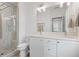 Modern bathroom with double vanity, a tiled shower, and excellent light at 3 Becker Nw Pl, Atlanta, GA 30307
