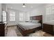Comfortable bedroom with a queen-sized bed, hardwood floors, and shuttered windows at 3 Becker Nw Pl, Atlanta, GA 30307