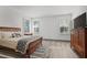 Bedroom with hardwood floors, plenty of light, and closet at 3 Becker Nw Pl, Atlanta, GA 30307