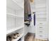 Walk-in closet with custom shelving, drawers, and plenty of storage space at 3 Becker Nw Pl, Atlanta, GA 30307
