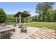 Community area featuring a fire pit, seating area, and lush greenery at 3 Becker Nw Pl, Atlanta, GA 30307