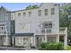 Charming three-story townhome with balcony and neutral gray paint at 3 Becker Nw Pl, Atlanta, GA 30307