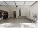 Spacious garage with high ceilings, epoxy flooring, water heater, and ample storage space at 3 Becker Nw Pl, Atlanta, GA 30307