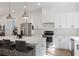 Bright, spacious kitchen with island, stainless appliances, and modern finishes at 3 Becker Nw Pl, Atlanta, GA 30307